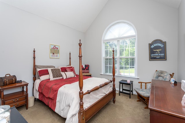 bedroom featuring vaulted ceiling and carpet floors
