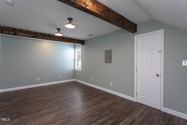 empty room featuring dark wood-type flooring, electric panel, and baseboards