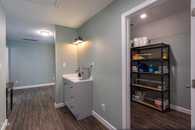 bathroom featuring wood finished floors and baseboards