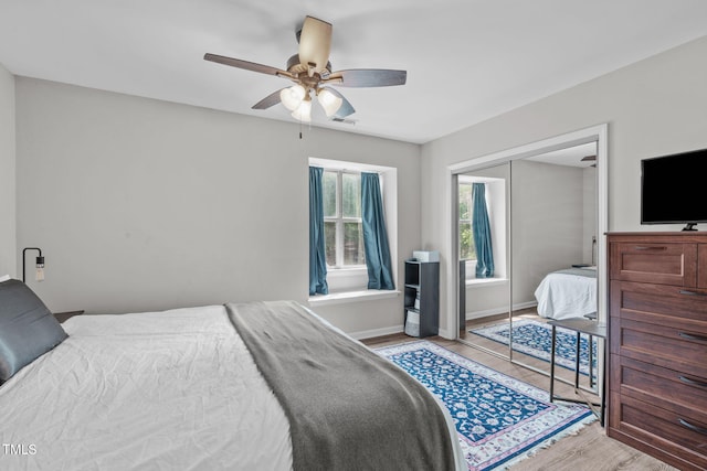 405 Gooseneck Dr Unit B6, Cary, NC 27513 - bedroom featuring a closet, light wood-style floors, a ceiling fan, and baseboards