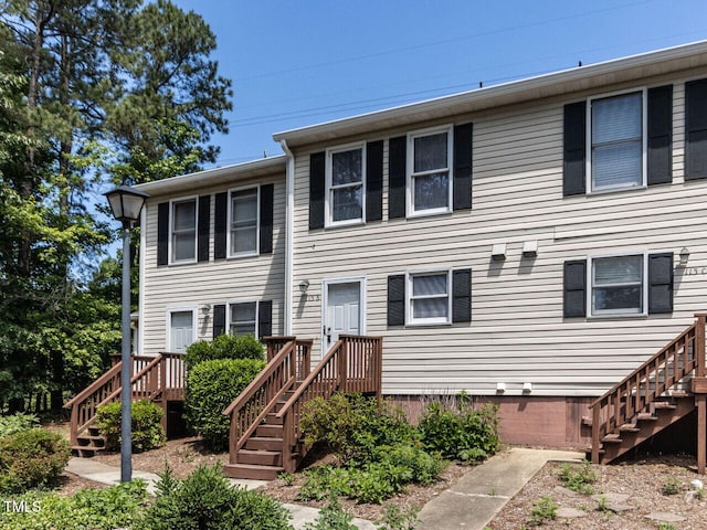 view of property featuring stairway