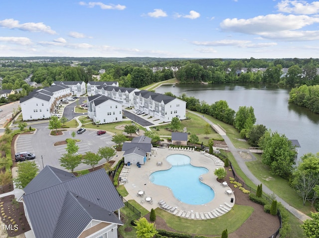aerial view of a nearby body of water and a pool area