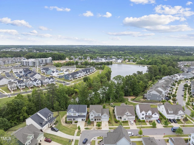 aerial view of residential area featuring a nearby body of water