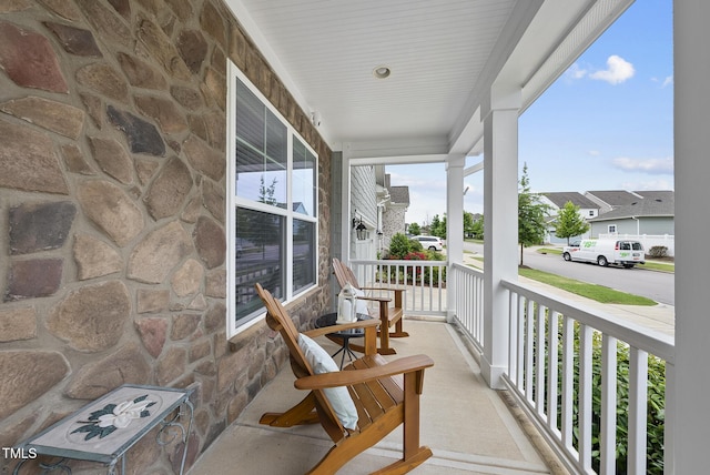 balcony featuring a porch
