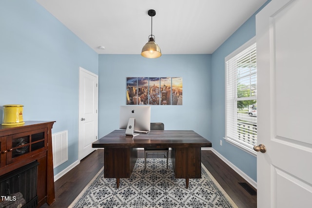 office with wood finished floors, plenty of natural light, and baseboards