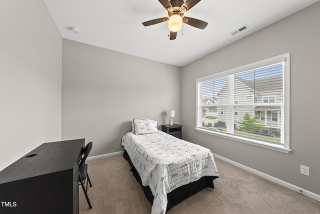 bedroom featuring baseboards, carpet flooring, and ceiling fan
