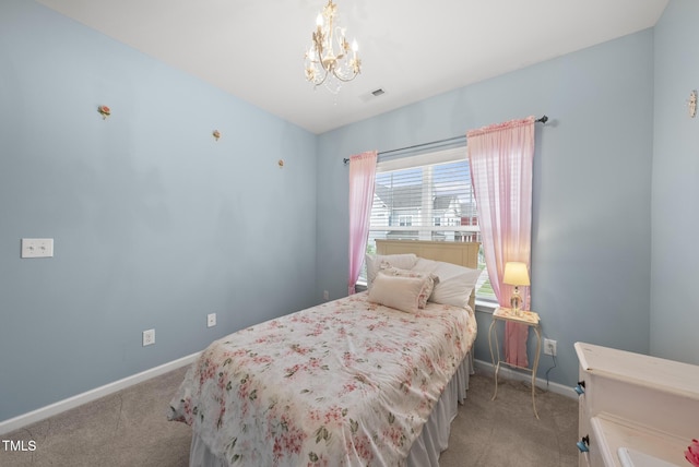 bedroom featuring light carpet, a chandelier, and baseboards