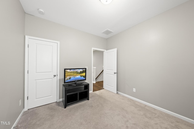 unfurnished bedroom with carpet and baseboards