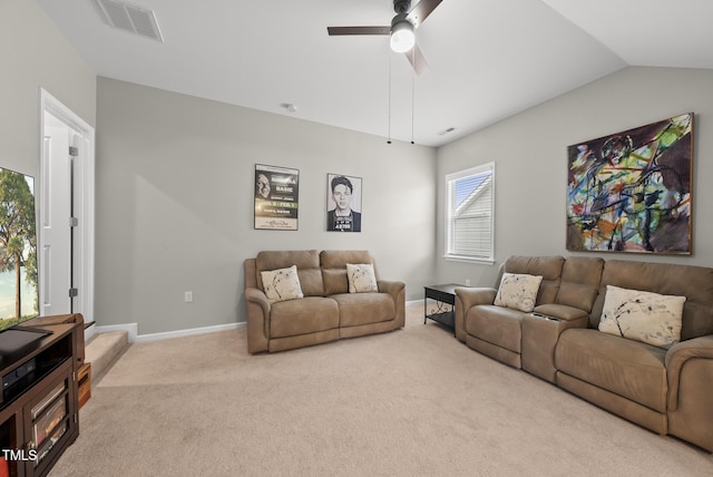 living room with carpet, a ceiling fan, baseboards, and lofted ceiling