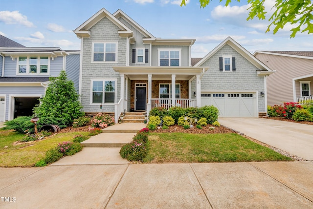 craftsman-style house with a porch, concrete driveway, and a garage