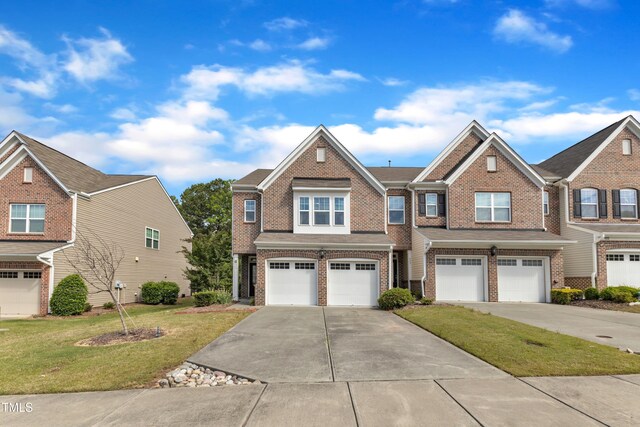 416 Durants Neck Ln, Morrisville, NC 27560 - view of property with brick siding, an attached garage, concrete driveway, and a front yard