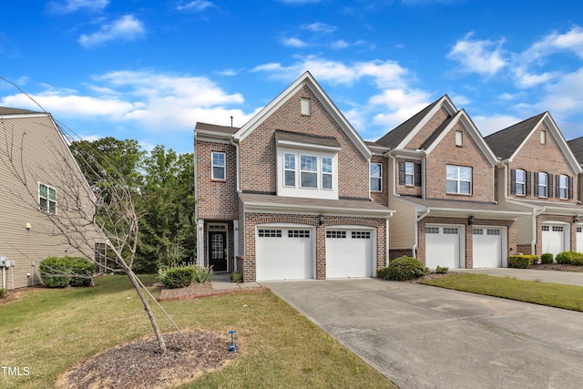 416 Durants Neck Ln, Morrisville, NC 27560 - view of front of home featuring brick siding, an attached garage, driveway, and a front yard