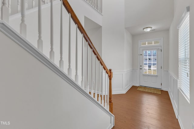 416 Durants Neck Ln, Morrisville, NC 27560 - entryway with wood finished floors, wainscoting, stairway, and a decorative wall