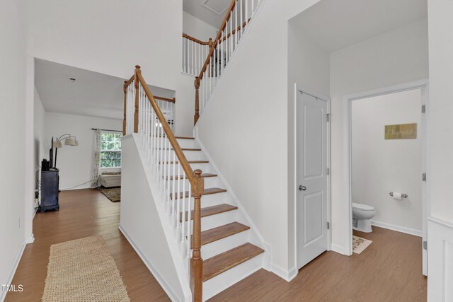 416 Durants Neck Ln, Morrisville, NC 27560 - stairs with wood finished floors, baseboards, and a high ceiling