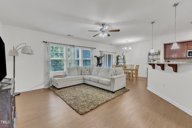 416 Durants Neck Ln, Morrisville, NC 27560 - living area featuring ceiling fan, wood finished floors, baseboards, and a chandelier