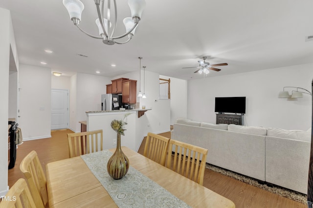 416 Durants Neck Ln, Morrisville, NC 27560 - dining space featuring a ceiling fan, light wood-type flooring, recessed lighting, a chandelier, and baseboards