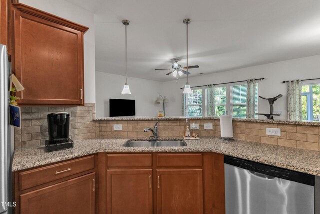 416 Durants Neck Ln, Morrisville, NC 27560 - kitchen featuring stainless steel appliances, a sink, a ceiling fan, backsplash, and brown cabinetry