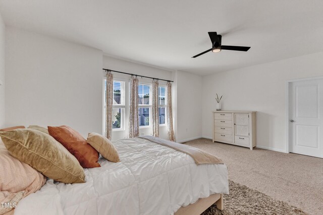 416 Durants Neck Ln, Morrisville, NC 27560 - carpeted bedroom featuring baseboards and a ceiling fan