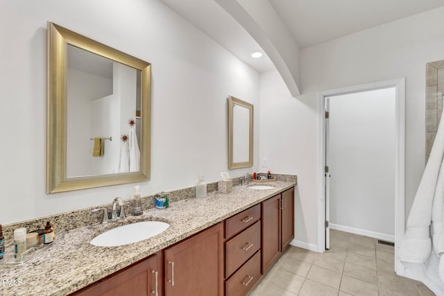 416 Durants Neck Ln, Morrisville, NC 27560 - bathroom with double vanity, tile patterned flooring, and baseboards