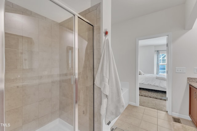 416 Durants Neck Ln, Morrisville, NC 27560 - ensuite bathroom featuring vanity, a shower stall, tile patterned floors, and baseboards