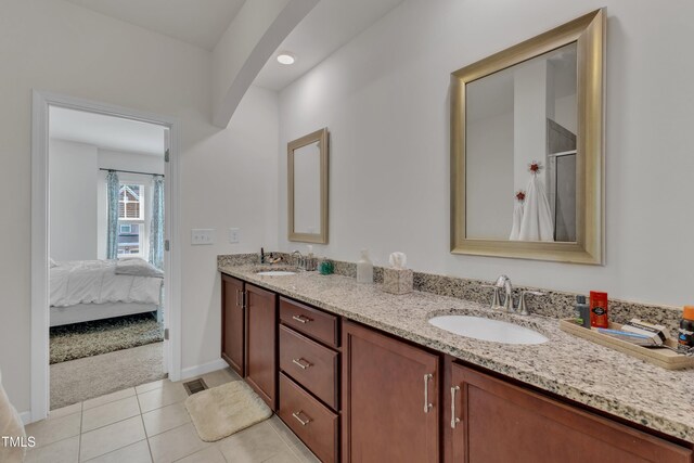 416 Durants Neck Ln, Morrisville, NC 27560 - full bath with double vanity, tile patterned flooring, baseboards, ensuite bath, and a shower with door