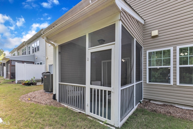 416 Durants Neck Ln, Morrisville, NC 27560 - view of home's exterior with a sunroom, central AC, and a yard