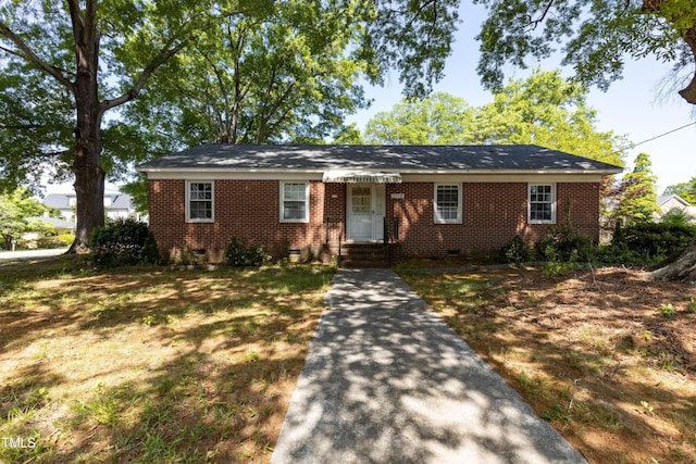 ranch-style home featuring brick siding and crawl space