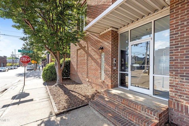 320 W Martin St Unit 205, Raleigh, NC 27601 - doorway to property with brick siding