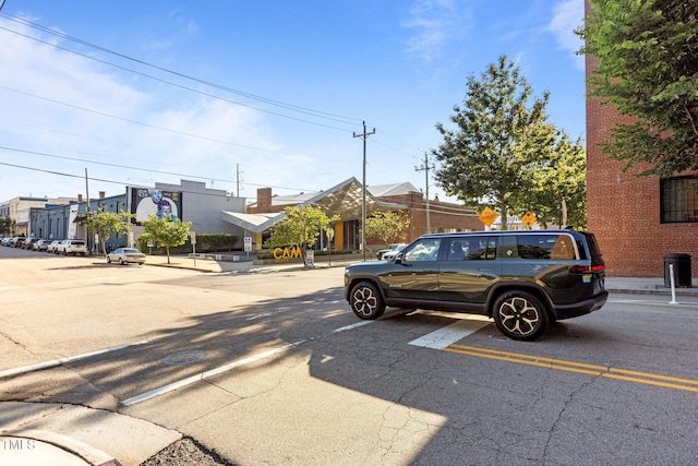 320 W Martin St Unit 205, Raleigh, NC 27601 - view of vehicle parking with a residential view