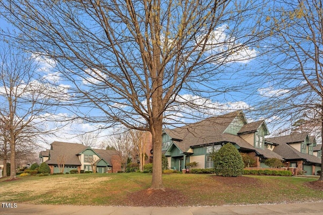 view of front facade featuring a front yard and a residential view