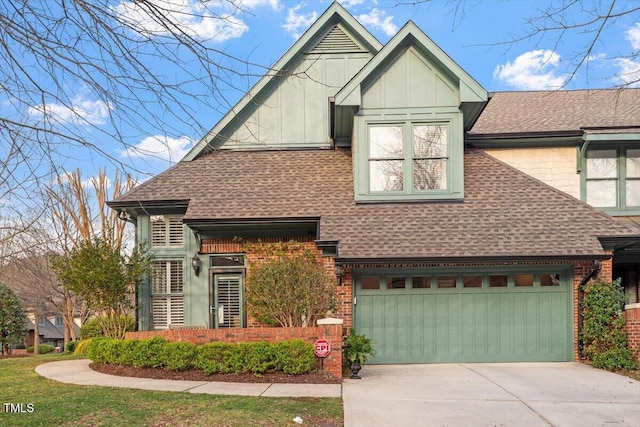 view of front of property with roof with shingles, concrete driveway, and brick siding