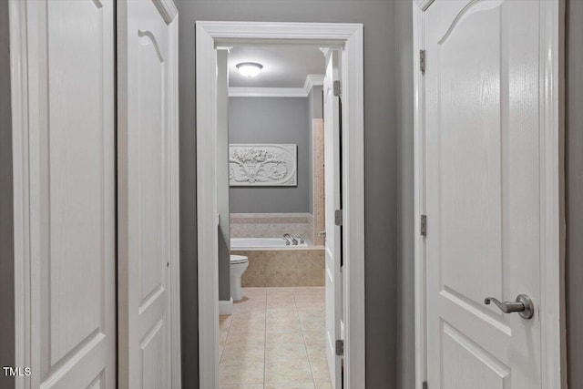 corridor featuring crown molding and tile patterned floors