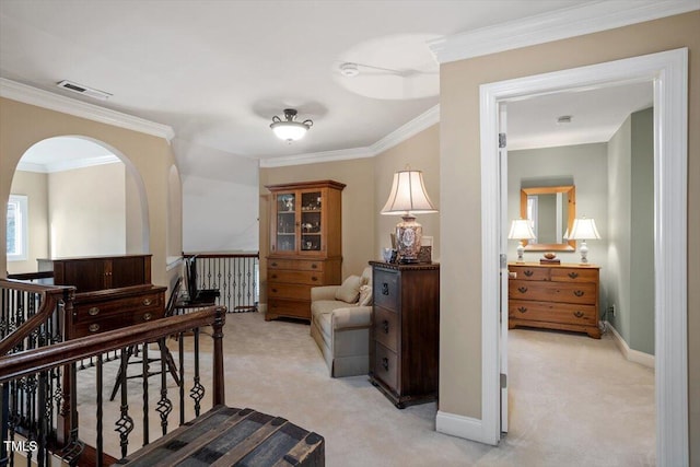 sitting room featuring light carpet, an upstairs landing, ornamental molding, baseboards, and arched walkways