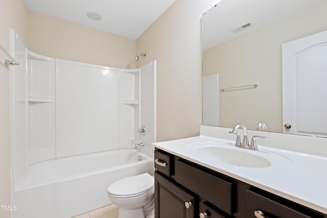 full bath featuring toilet, vanity, shower / bath combination, and tile patterned flooring