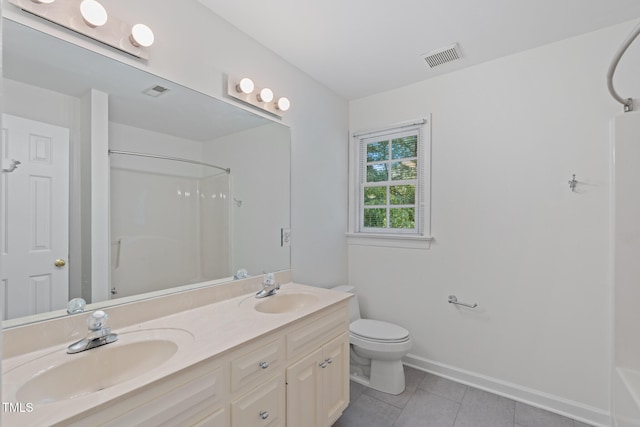 full bathroom with tile patterned floors, toilet, double vanity, baseboards, and washtub / shower combination