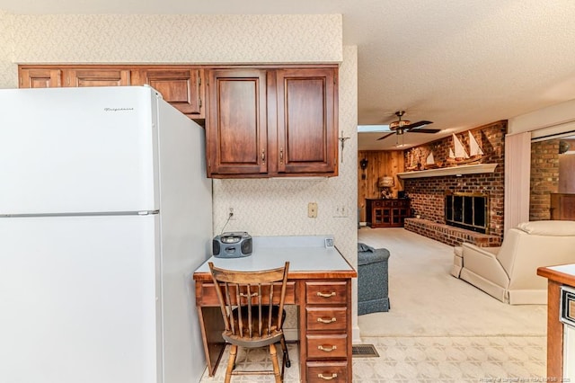 241 Firetree Ln, West End, NC 27376 - kitchen with a ceiling fan, freestanding refrigerator, open floor plan, light colored carpet, and light countertops