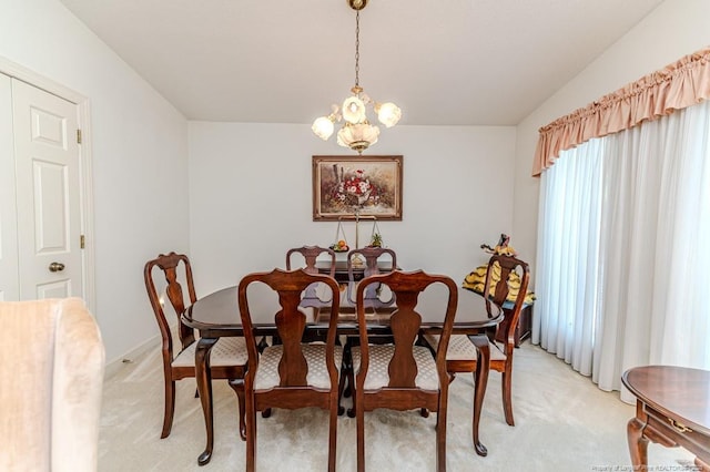 241 Firetree Ln, West End, NC 27376 - dining area with baseboards, light carpet, and a chandelier