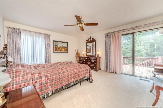 241 Firetree Ln, West End, NC 27376 - carpeted bedroom with a ceiling fan, visible vents, and access to exterior