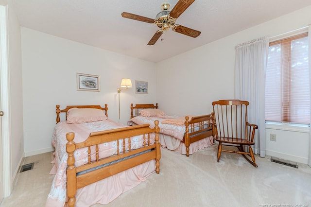 241 Firetree Ln, West End, NC 27376 - bedroom with carpet flooring, multiple windows, and visible vents