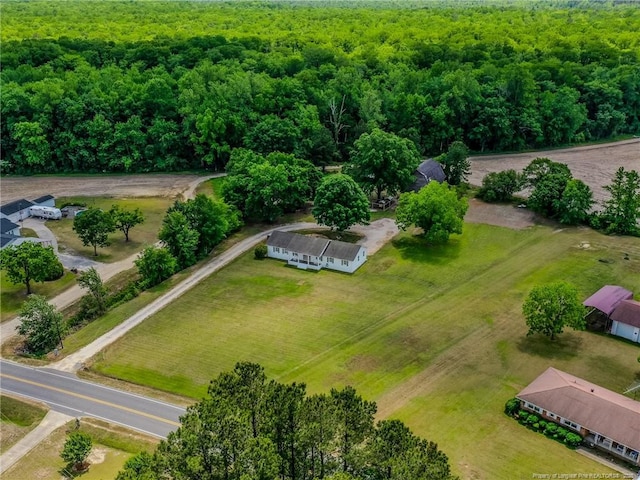 aerial view with a wooded view and a rural view