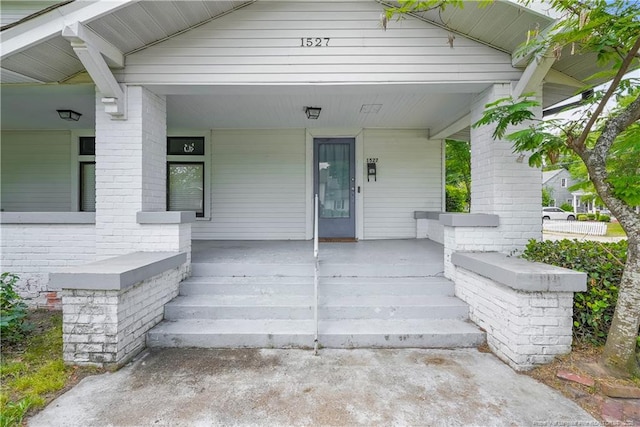 1527 Fort Bragg Rd, Fayetteville, NC 28305 - doorway to property featuring a porch and brick siding