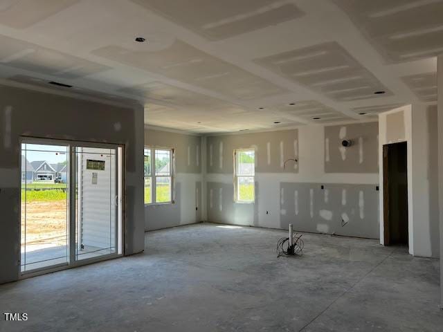 unfurnished living room featuring unfinished concrete flooring