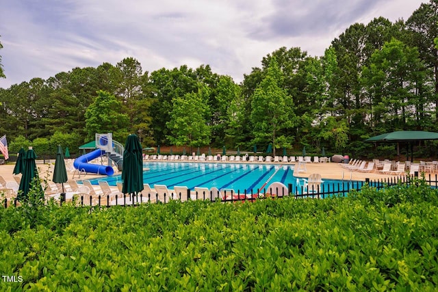 community pool with a water slide