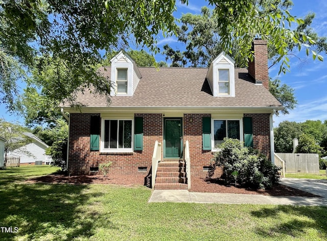 1305 Shakentown St, Knightdale, NC 27545 - cape cod house featuring entry steps, a chimney, a front yard, a shingled roof, and crawl space