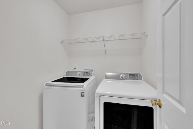 washroom with washer and clothes dryer