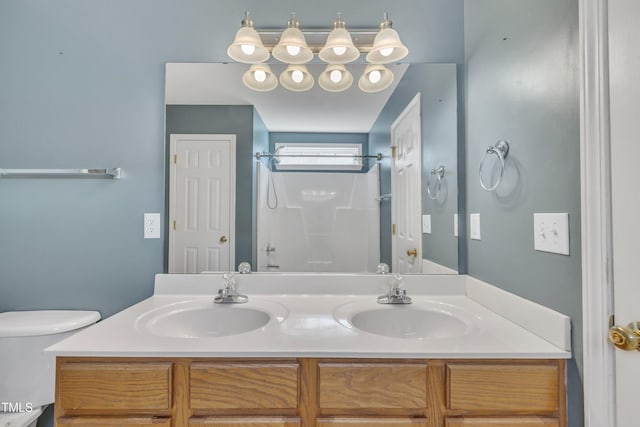 full bath featuring a shower, double vanity, and toilet