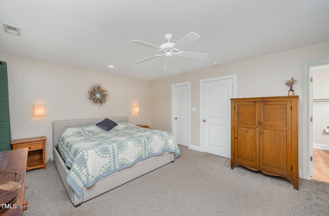 bedroom with light colored carpet, a ceiling fan, baseboards, and recessed lighting