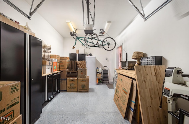 garage featuring a garage door opener