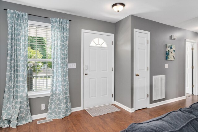entryway featuring wood finished floors and baseboards