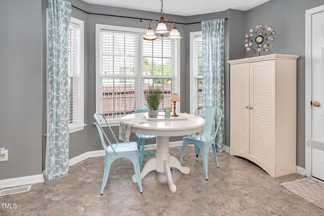 dining area featuring baseboards
